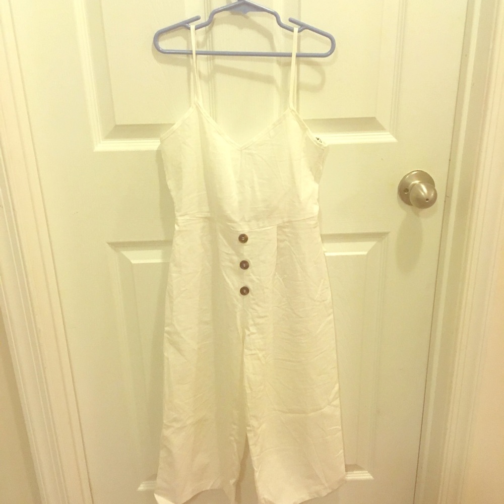 A girls white with button up front cami jumpsuit
